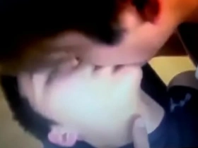 Steamy encounter of young Asian men indulging in oral pleasures and tender kisses