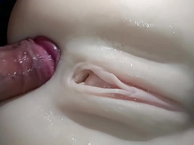 Intimate view of a young girl receiving anal penetration with a toy