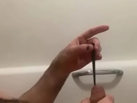 Masturbating with a dildo for penis stimulation