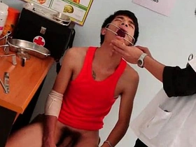 Young man undergoes rectal examination by attractive doctor