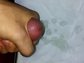 Asian teen masturbates to climax in solo video